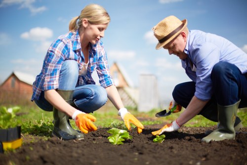Technician handling garden chemicals with protective gloves